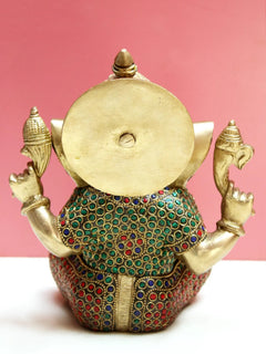 Brass Lord Ganesha statue, back view with round back detail and jeweled dress