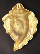 Back of 9-inch brass Ganesha wall mask, textured finish with hanging loop