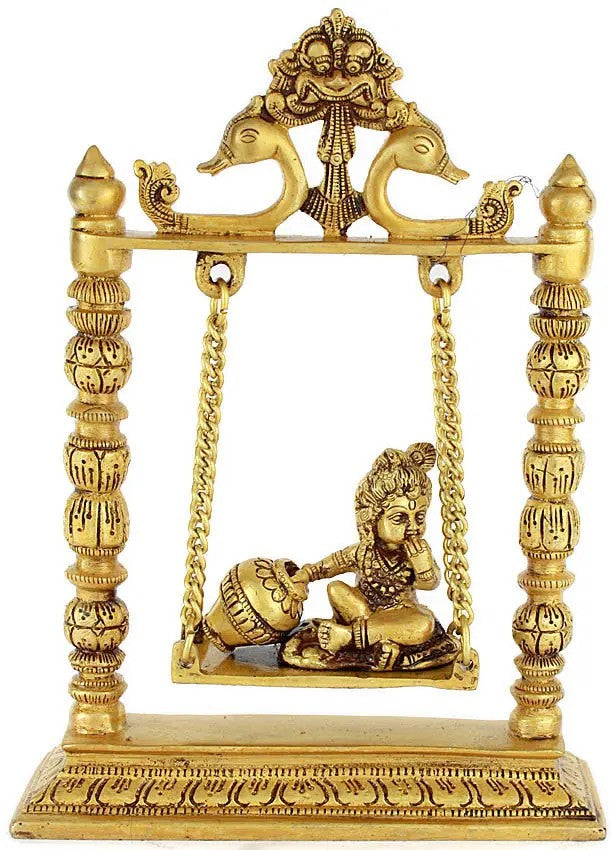 Handmade brass Krishna idol on swing, 10 inches, seated figure with ornate frame