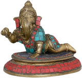 Seated brass Ganesha figurine, trunk raised left, red turquoise mosaic details