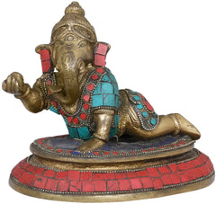 Seated brass Ganesha figurine, trunk raised left, red turquoise mosaic details