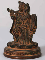 Small brass Radha Krishna figurine with raised hand, ornate etched details