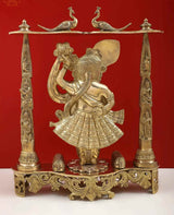 Golden brass Shrinath Ji statue in profile pose, decorative columns and canopy