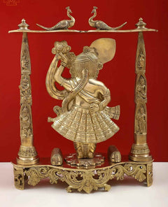 Golden brass Shrinath Ji statue in profile pose, decorative columns and canopy