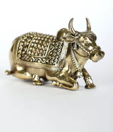 Brass Nandi statue close-up, decorated saddle and legs on a 4-inch figurine