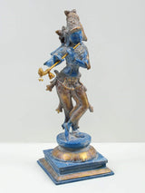 Blue brass Lord Krishna playing flute statue on blue base, standing pose