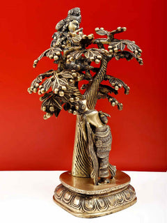 Natural brass Krishna and Radha sculpture, Krishna on mounted tree limbs, standing on round base
