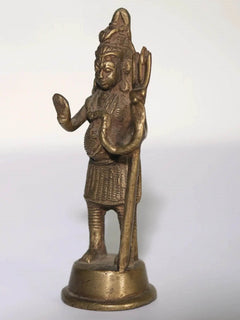 Small brass Lord Shiva statue side view, hands raised in blessing, on round base