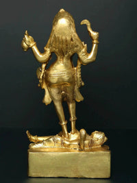 Back view of brass Kali statue standing on Shiva base, ornate draped skirt