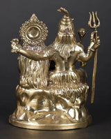 Brass sculpture rear/side view: Shiva with trident and raised hands, Parvati seated