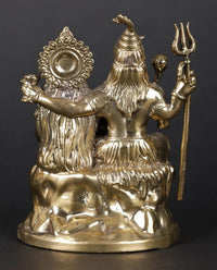 Brass sculpture rear/side view: Shiva with trident and raised hands, Parvati seated