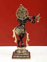 Back view of black brass Lord Krishna flute statue with decorative halo, 12 inch