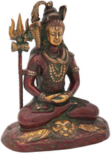 Seated Shiva statue with golden trident and layered jewelry, red-green finish, 10-inch