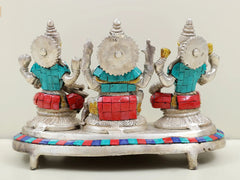 Lakshmi, Ganesha, Saraswati brass statue trio, rear view with raised arms