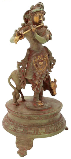 Handmade Venugopala brass idol, green-gold patina, flute held near face, on base