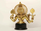 Natural brass Krishna figure holding instruments, side view on round black base