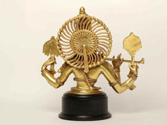 Natural brass Krishna figure holding instruments, side view on round black base