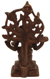 Brass Dakshinamurti Shiva statue in profile, raised arm and ornate cutout backdrop, 6-inch