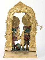 Brass Radha-Krishna statue in arched frame, jeweled red green blue inlay work