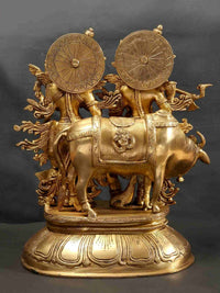 Brass Radha Madhav statue with cow, ornate back wheels and engraved detailing
