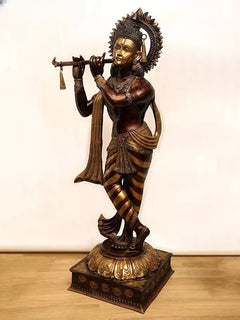 Brass Murli Krishna statue with ornate crown, flute held at side, striped dhoti