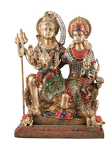 Brass Lord Shiva family statue, seated figures with trident and colorful gemstone-style details