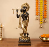 Brass Lord Murli Krishna idol, black-and-gold figure holding a flute