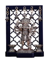 Brass Panchmukhi Hanuman idol on temple frame, with hanging bells and diya holders