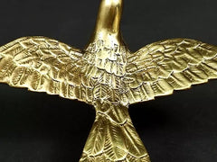 Brass eagle wall figurine close-up of wings and detailed feather textures