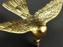 Brass eagle wall figurine side view, raised wings with textured feathers
