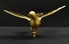 Brass eagle wall decor figurine, front view with beak and long tail