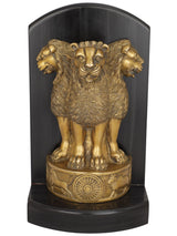 Brass lion figurine on circular wheel base, Ashoka pillar style, front close-up