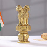 Brass lion capital figurine with three lions in profile and wheel emblems on pedestal