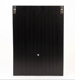 Black back panel of wall hanging with two mounting holes and small hanging loop