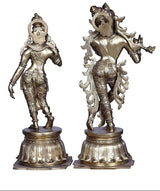 Brass Radha-Krishna idol pair, side view showing Krishna’s flute and Radha’s crown