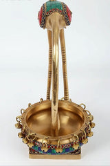Leaning brass flamingo urli with beaded ring bowl and painted mosaic details