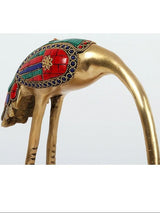 Leaning brass flamingo figurine head with red, green, blue enamel mosaic accents