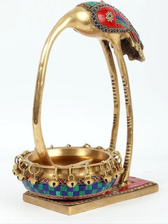 Full brass flamingo urli with arched body, chain-rim bowl, and multicolor enamel band