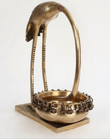 Brass leaning flamingo urli with ornate chain border and flat square base