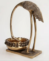 Brass flamingo urli angled view: curled neck arch and decorative chain tray rim