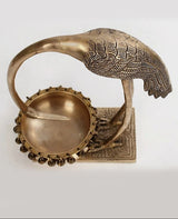 Brass flamingo urli close view of bowl top, chain rim, and engraved base