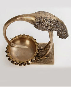 Brass flamingo urli close view of bowl top, chain rim, and engraved base