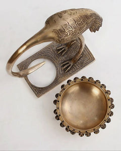 Brass flamingo urli top-down angle showing neck loop and round bowl