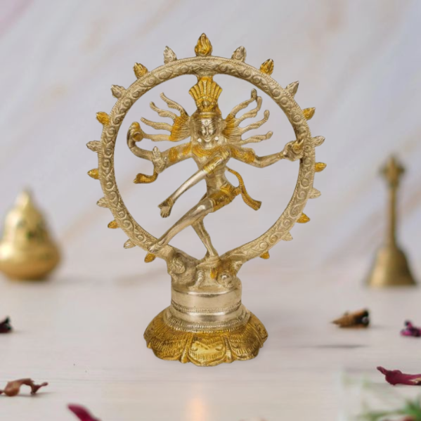 Gold-toned Nataraja brass sculpture: dancer with multiple arms inside ornate circular halo
