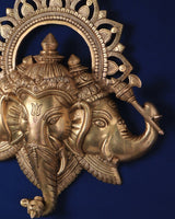 Pure brass Trimukhi Ganapati wall hanging close-up, three faces and raised trunk