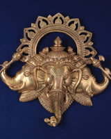Pure brass Trimukhi Ganapati wall hanging with ornate halo and four arms
