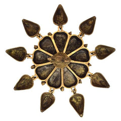 Brass paan box lid with peacock fan detail, leaf-shaped panels around the center