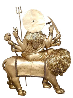 Brass Durga statue on lion, backside view with halo and trident