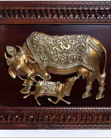 Brass Kamadhenu cow and calf wall art relief in ornate framed panel