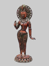 Standing Tara brass idol, raised palm gesture, detailed torso and draped attire